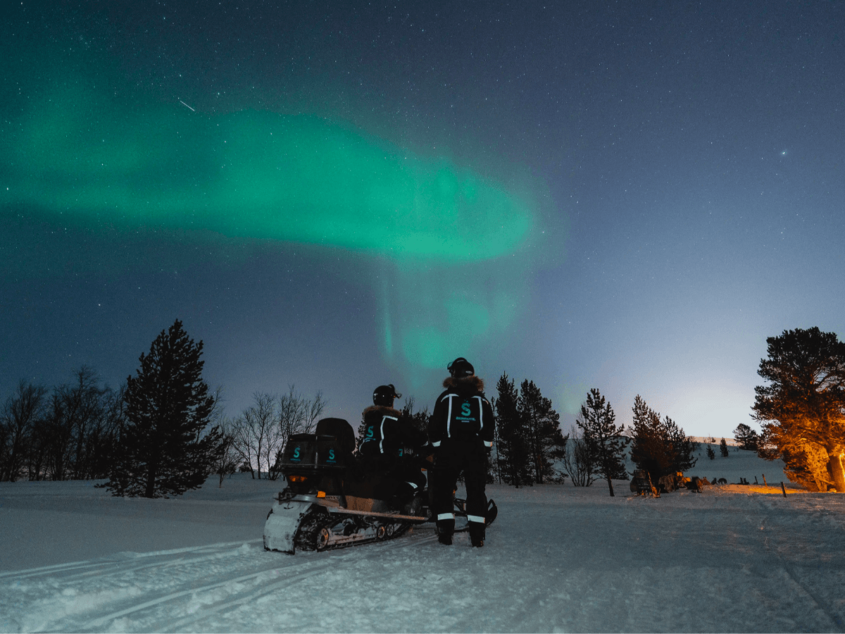 Hunting the Northern Lights by Snowmobile
