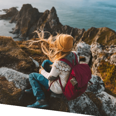 Two travellers looking out over the coast